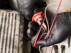 Cutting flat red TPS cables during wiring installation