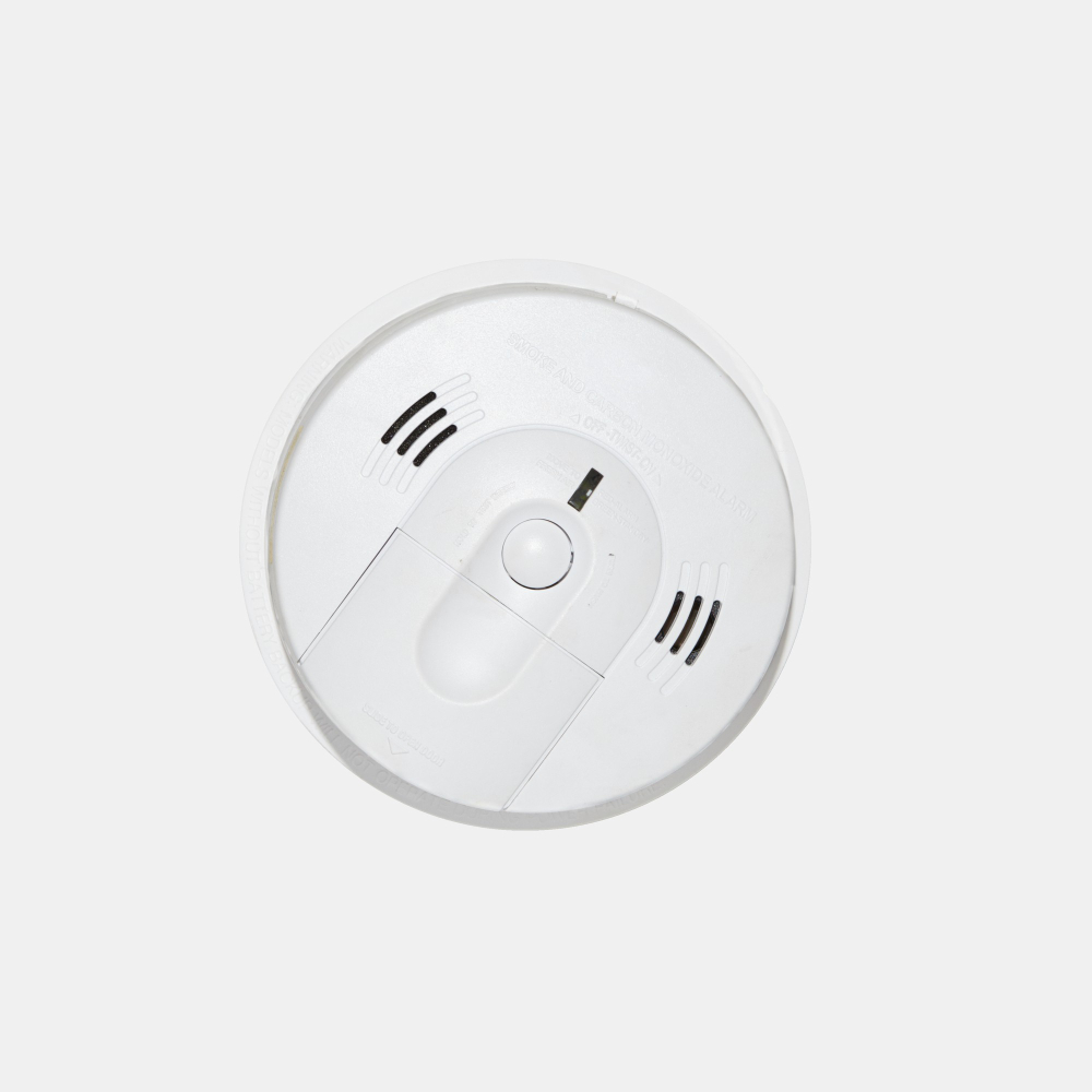 Ceiling-mounted PSA smoke alarm ensuring fire protection and compliance.