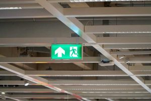 Exit emergency light with illuminated sign for safety and evacuation guidance