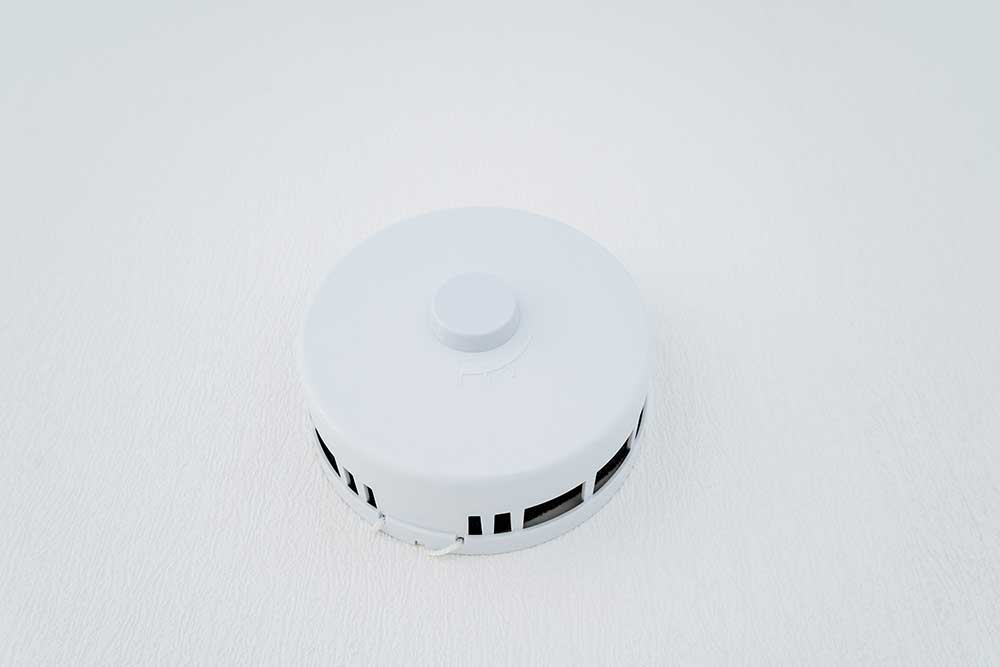 PSA smoke alarm fixed in the ceiling for fire safety and home protection